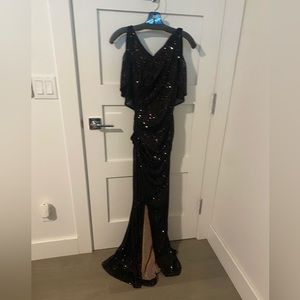 Talbot Runhof black sequin gown, cape and side slit.